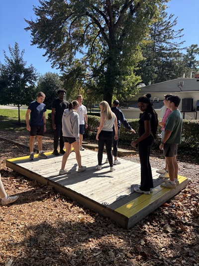 Students work together to complete the Villanova Challenge Course