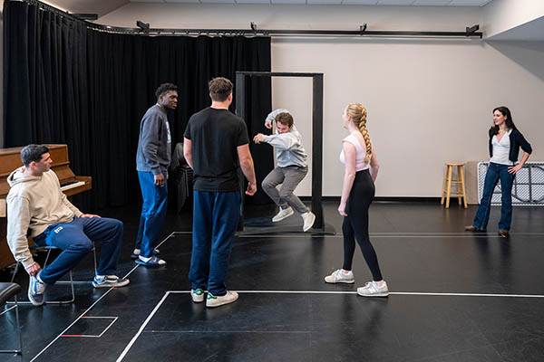 Students acting in theatre class