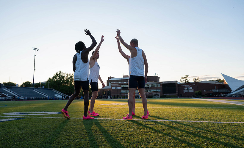 Students working out in the stadium.