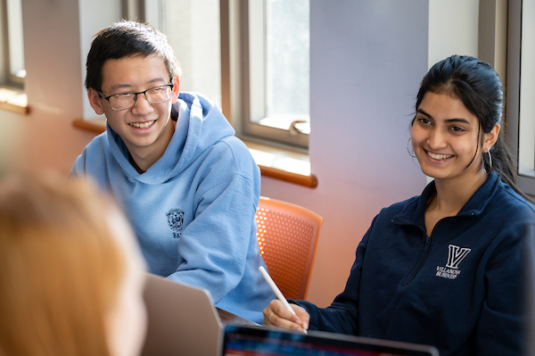 Simran talking with other students
