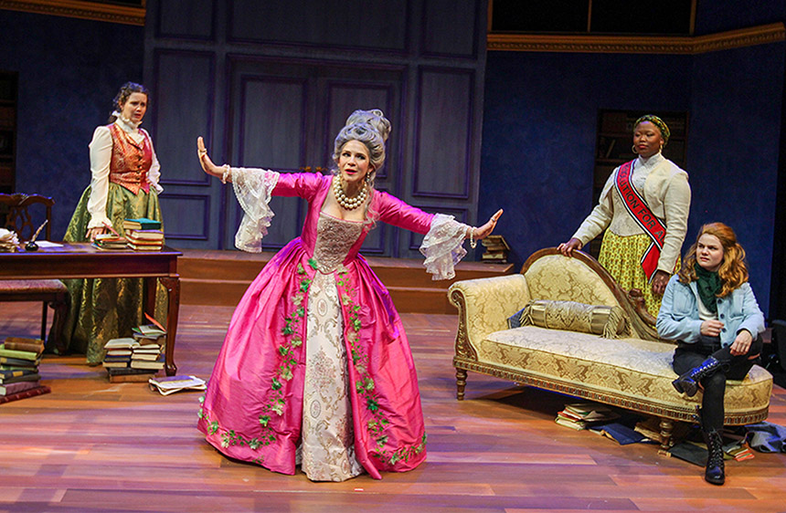 an actor portraying Marie Antoinette takes center stage, surrounded by three other actors, during a performance of "The Revolutionists"