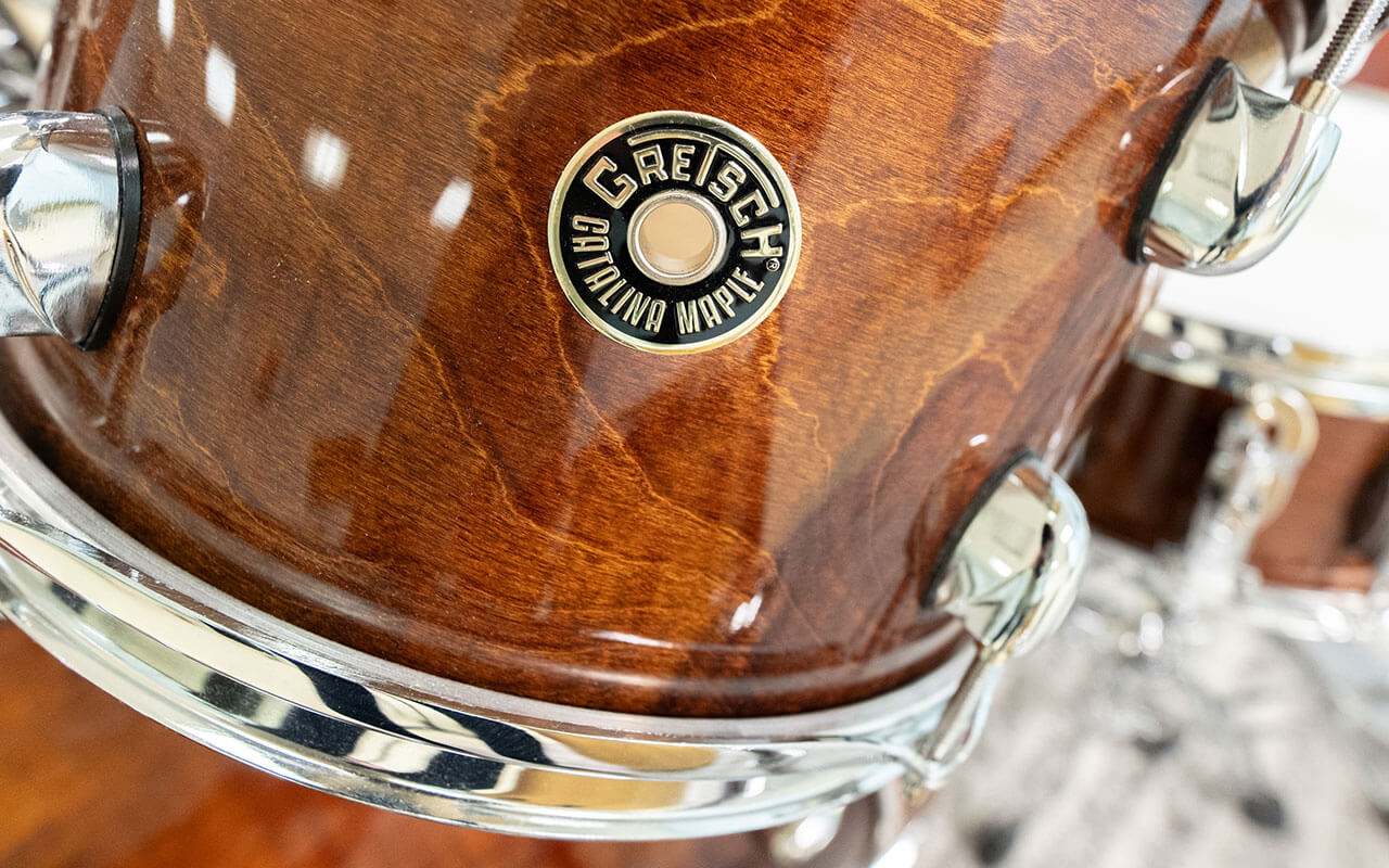 Close-up detail shot of a Gretsch Catalina Maple drum, highlighting its wood grain and hardware.