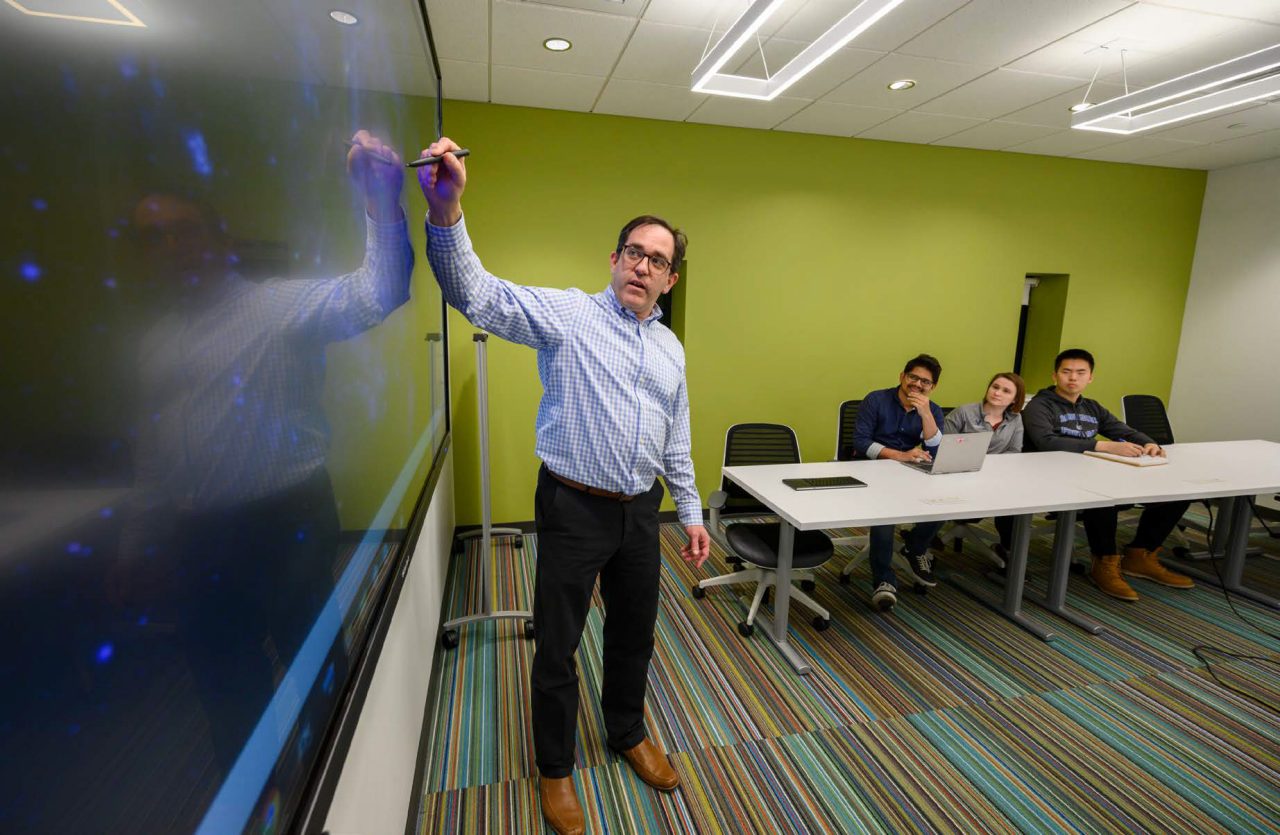 Man next to the display
