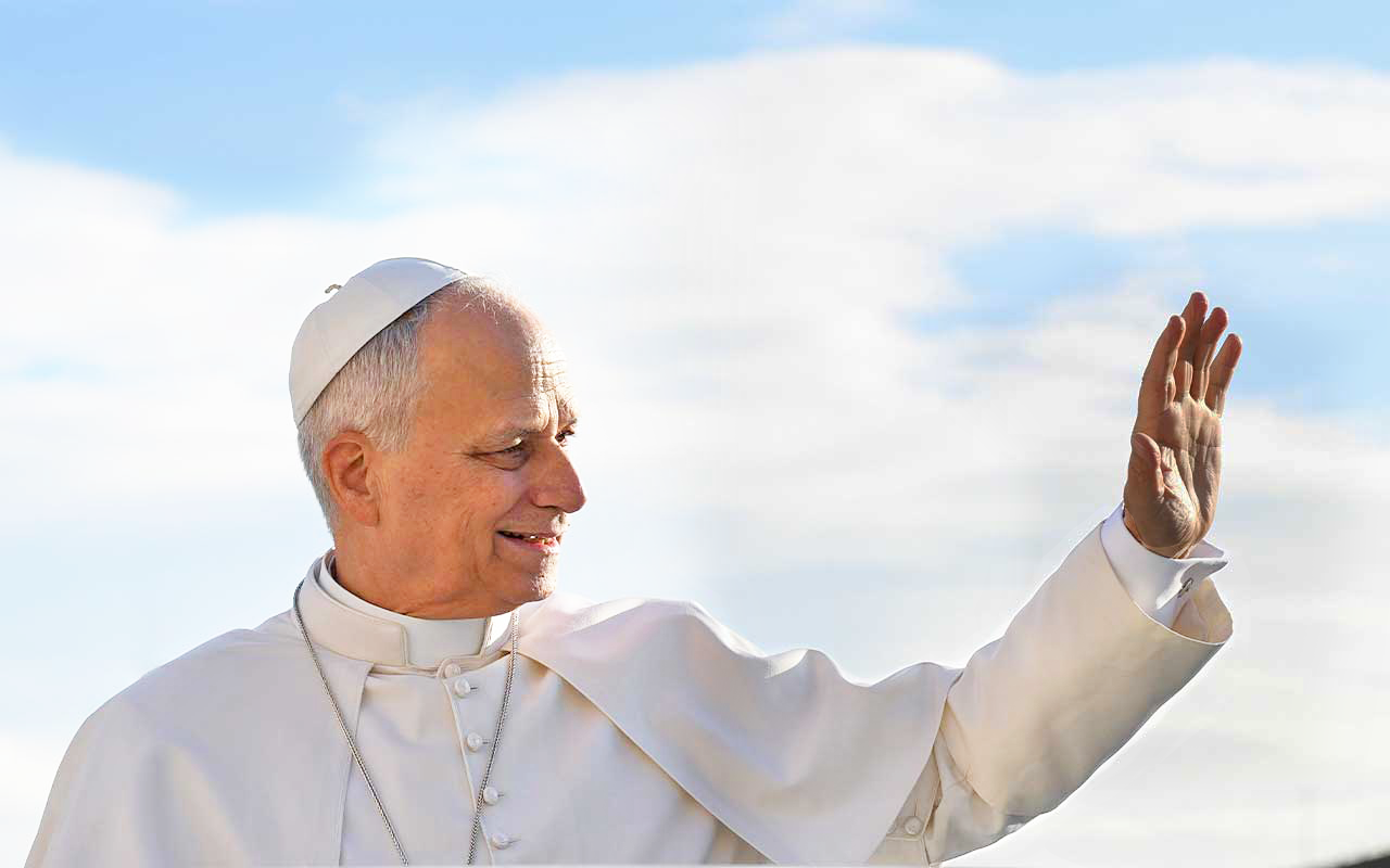 Pope Leo XIV raises a hand in greeting outdoors against a blue sky.