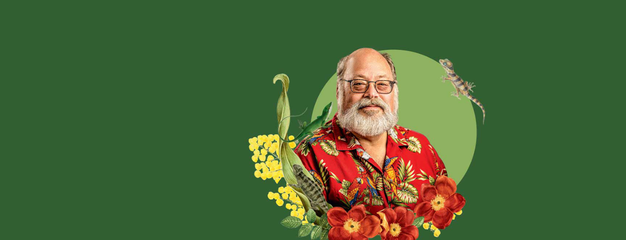Portrait of Aaron Bauer against a green background with illustrated flowers and reptiles.