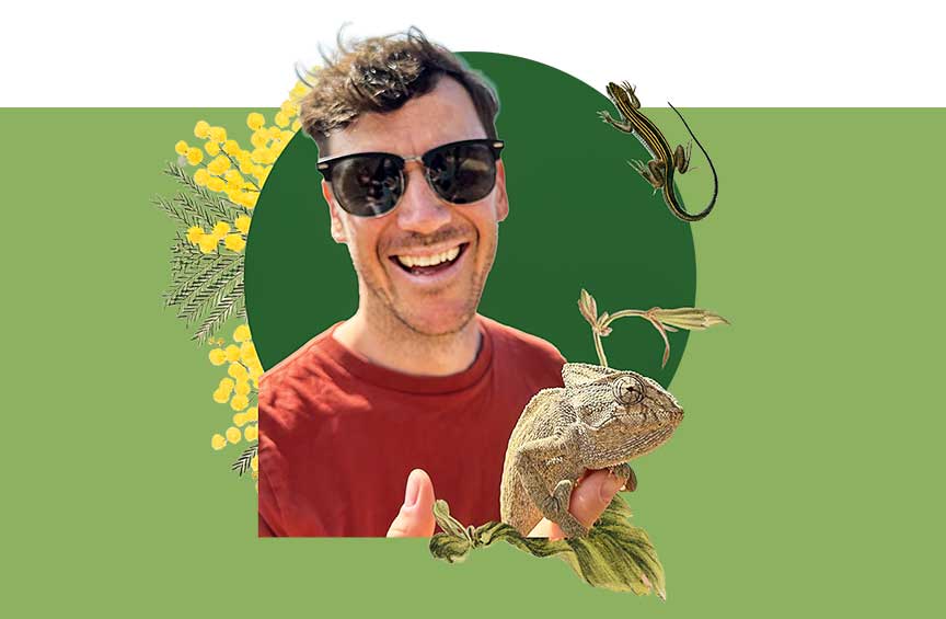 Portrait of Ian Brennan smiling while holding a lizard, set against a green background with illustrated plants.